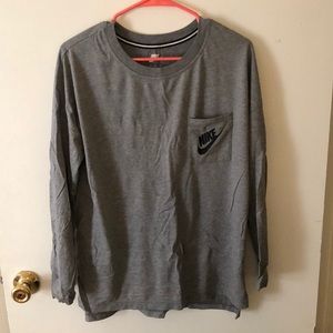 Long sleeve grey Nike tee shirt.